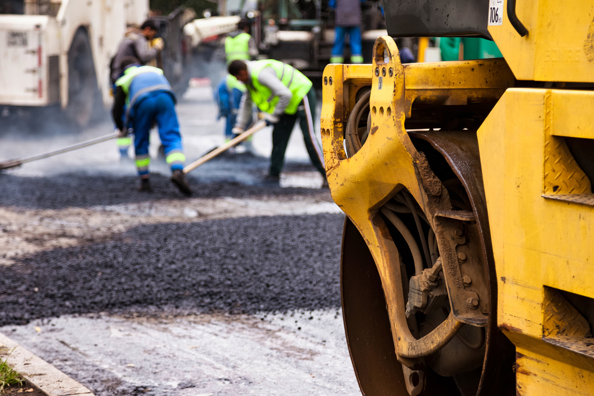 paving asphalt on urban roadway